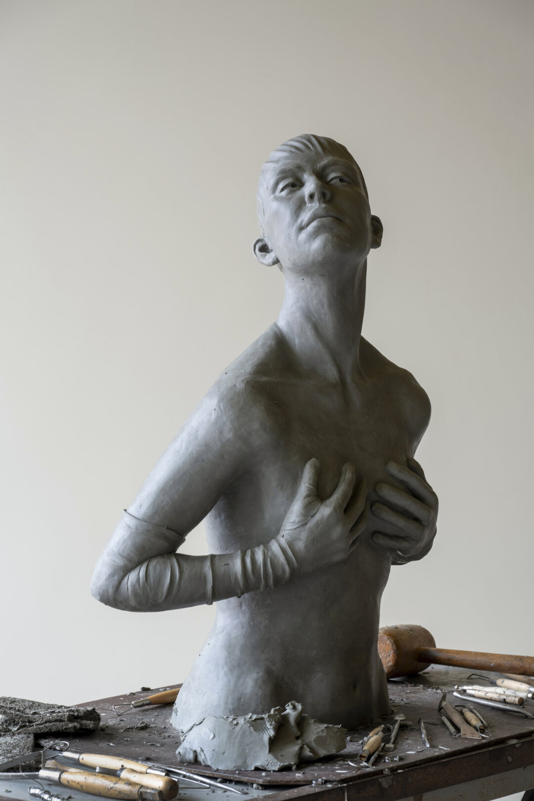 Clay sculpture of a young woman
