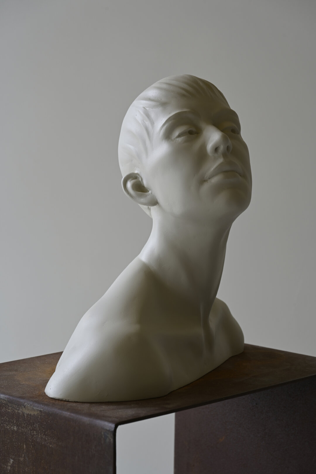 Acrylic white sculpture, buste of a young woman.